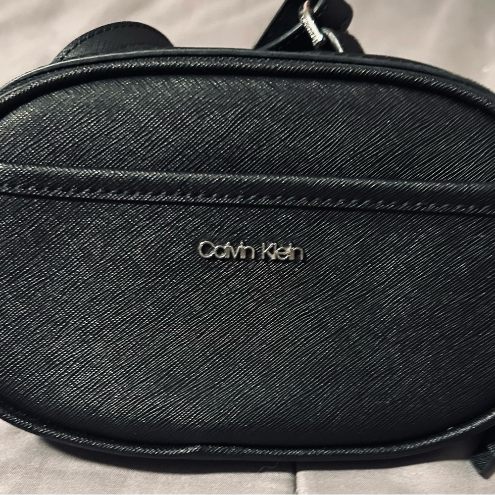 Calvin Klein Black over the shoulder purse.